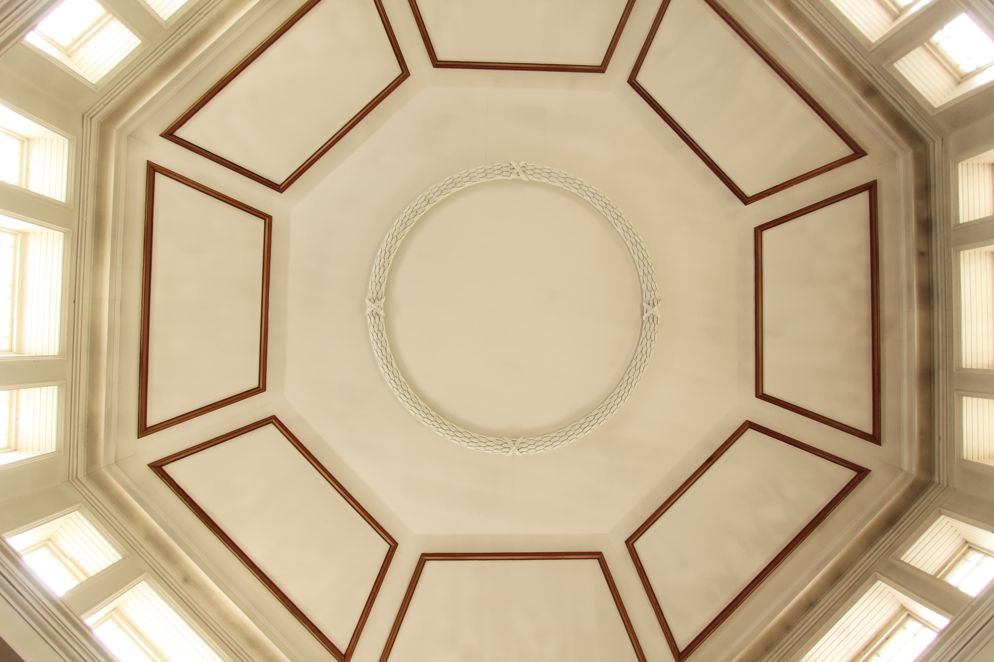 White ceiling shot of a circle area letting in light 
